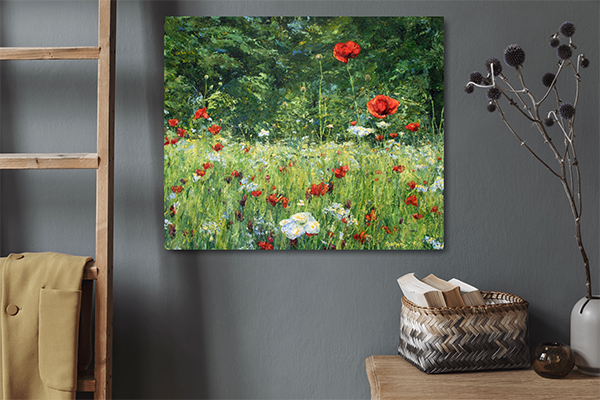 Interior with dark wall and rustic accessories, featuring a close view of a painting of wildflowers in a meadow with bright colours, mostly greens, reds and whites