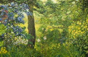 Close-crop of a Spring garden scene with a tree form to left, assorted branches, leaves and florals, especially leaning from the frame edges. Blue blossoming to the left dominates the image. Hazy land and organic forms discernible beyond the foreground botanicals.
